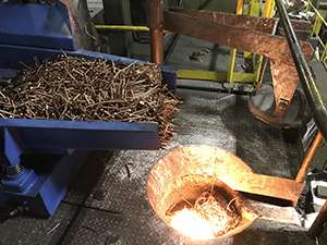 Vibratory Feeder Safely Conveys Copper into Furnace at Materion
